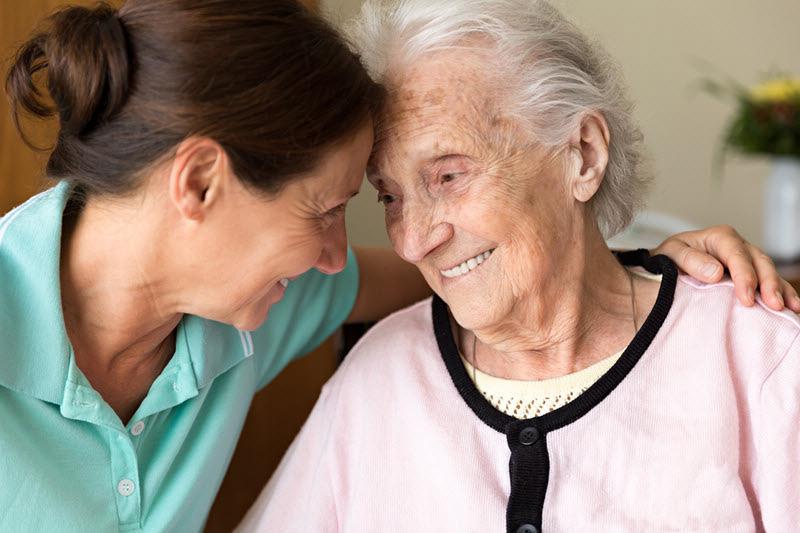 caregiver and elderly woman